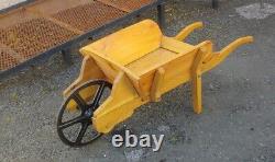 Handmade wooden wheelbarrow with cast iron wheel